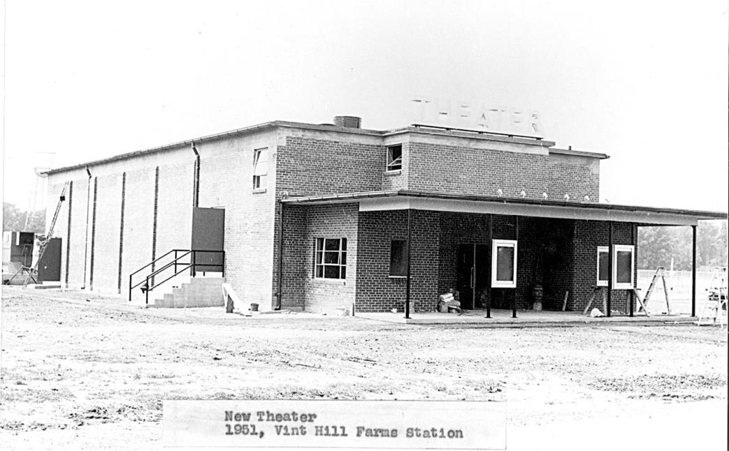 Black-and-white photograph of the brick theater building at Vint Hill Farms Station in 1951, with 'THEATER' lettering across the front.